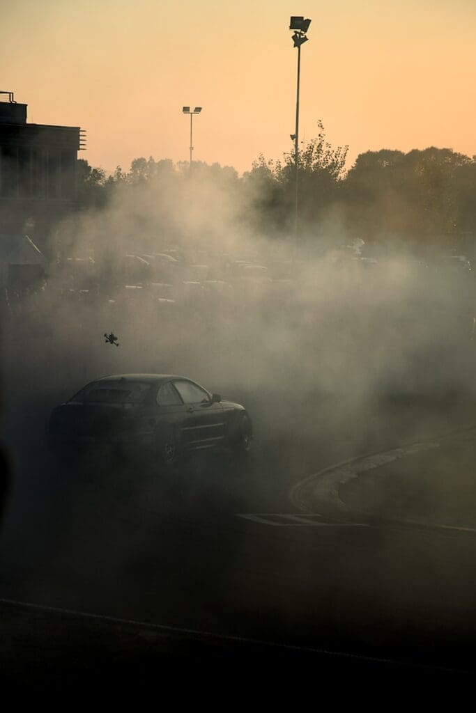 a parking lot filled with lots of smoke