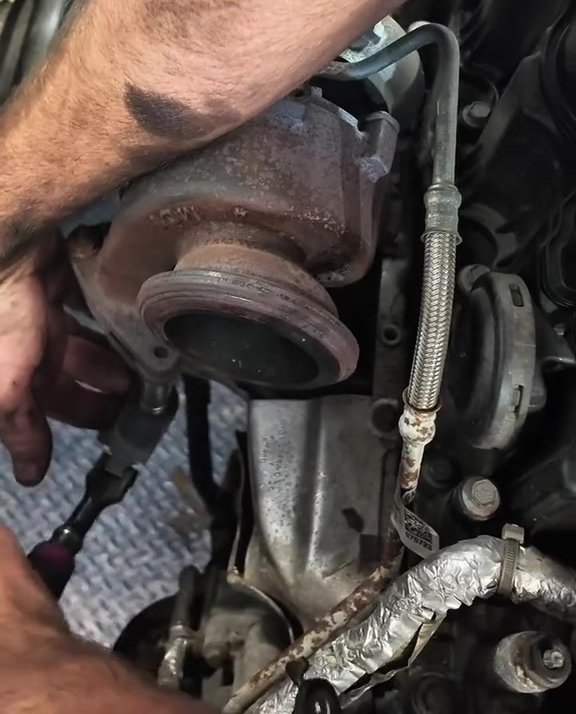 Worn turbocharger being removed from a 2017 Land Rover Discovery Sport at Star Garage Mansfield