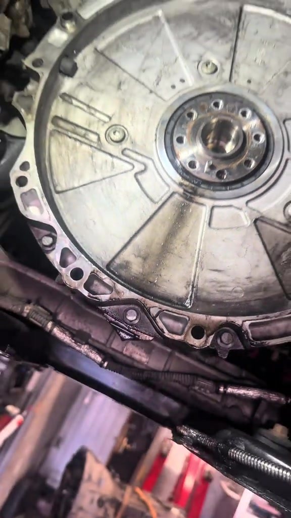 Flywheel exposed after removing the gearbox from a Jaguar for a rear main oil seal replacement