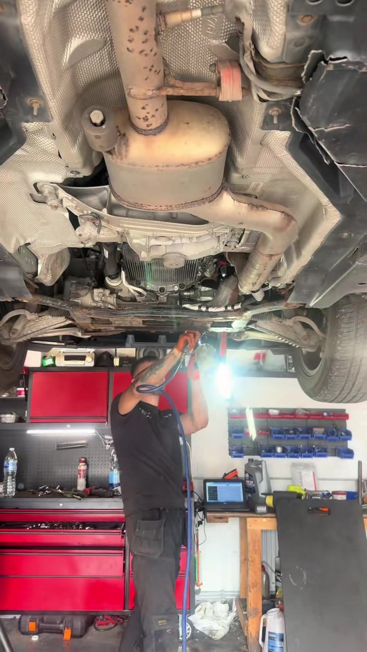 Underside of the Jaguar on the ramp during the differential oil leak repair